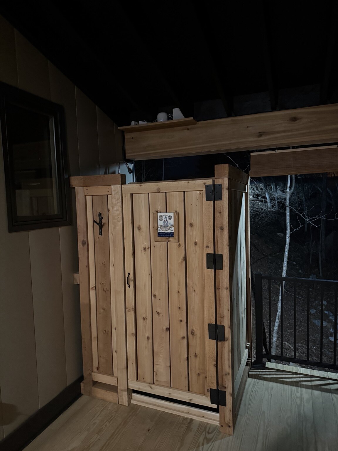 Custom cedar enclosure built on a covered deck